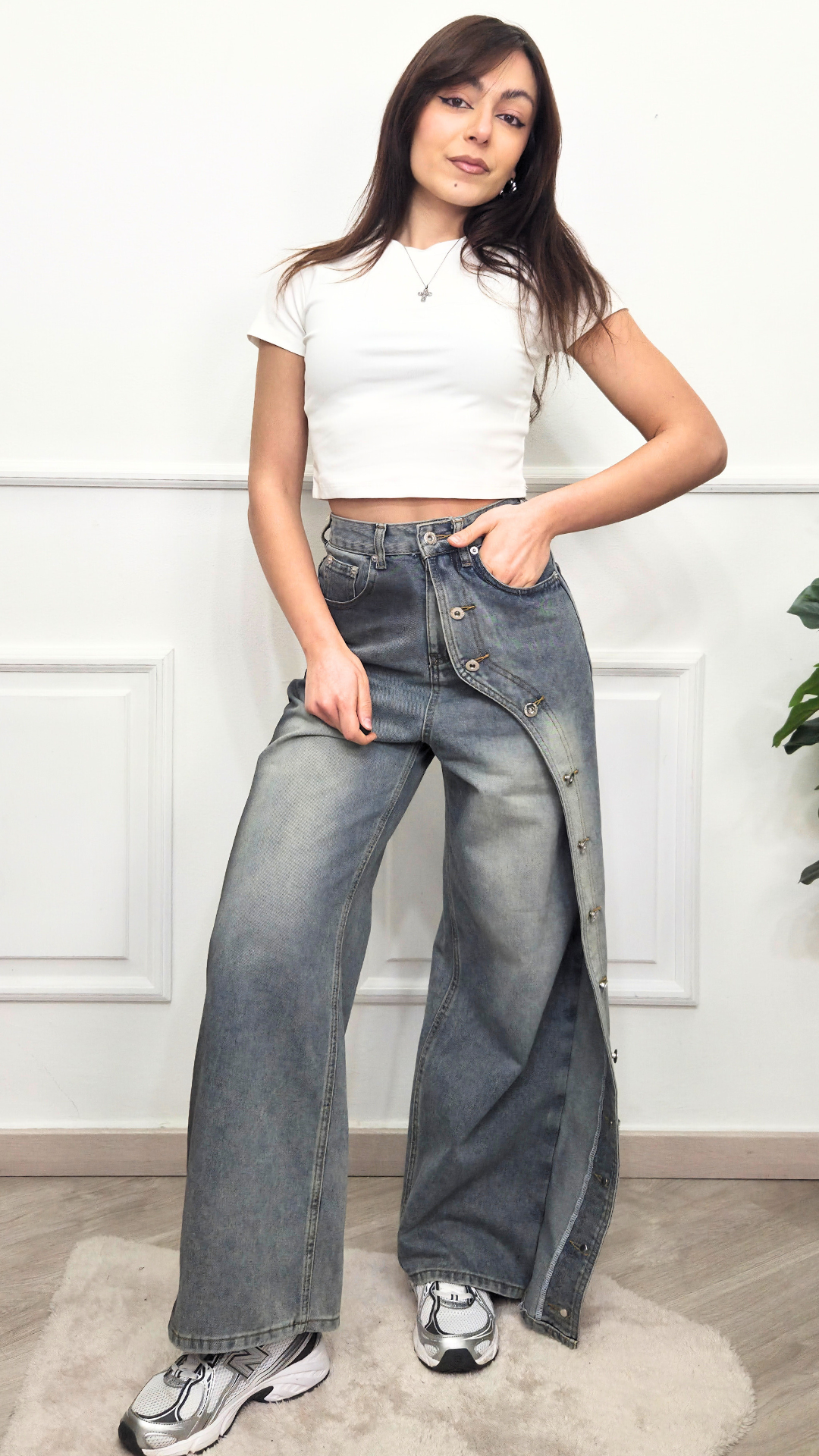 Jeans con bottoni laterali